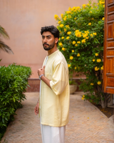 Open-front linen jacket with a small collar.